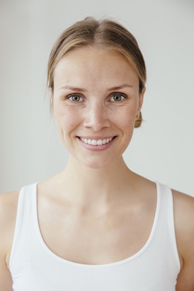 A warm morning light spilling across a quiet kitchen table with a journal and tea.