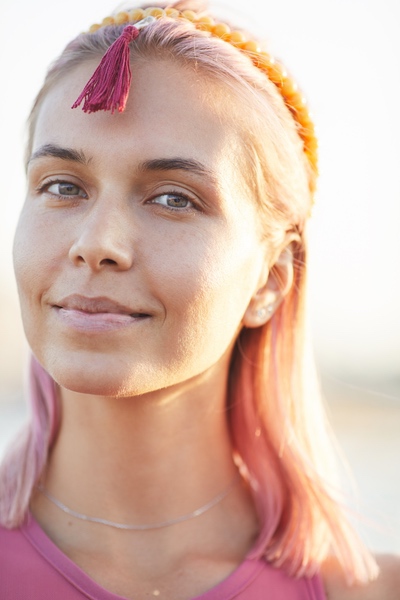 A winding path through trees with soft light ahead.