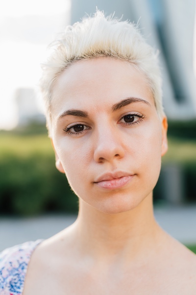 A quiet sunrise through a window with a journal and a soft blanket nearby.